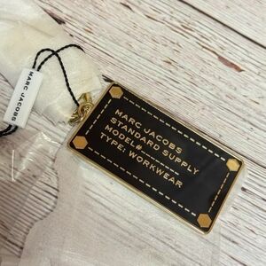 Marc Jacobs Black and Gold Tag